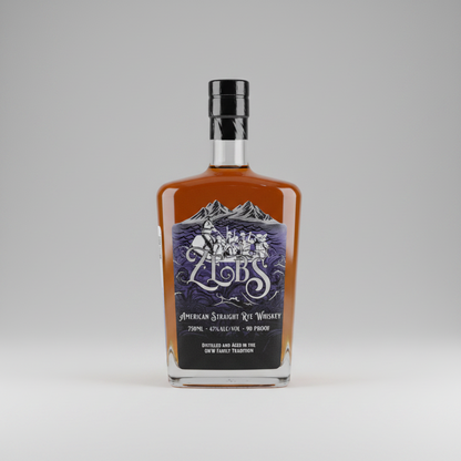 A bottle of Zleb's American Straight Rye Whiskey with amber liquid, a black cap, and a dark blue and white label, shown against a solid green background.