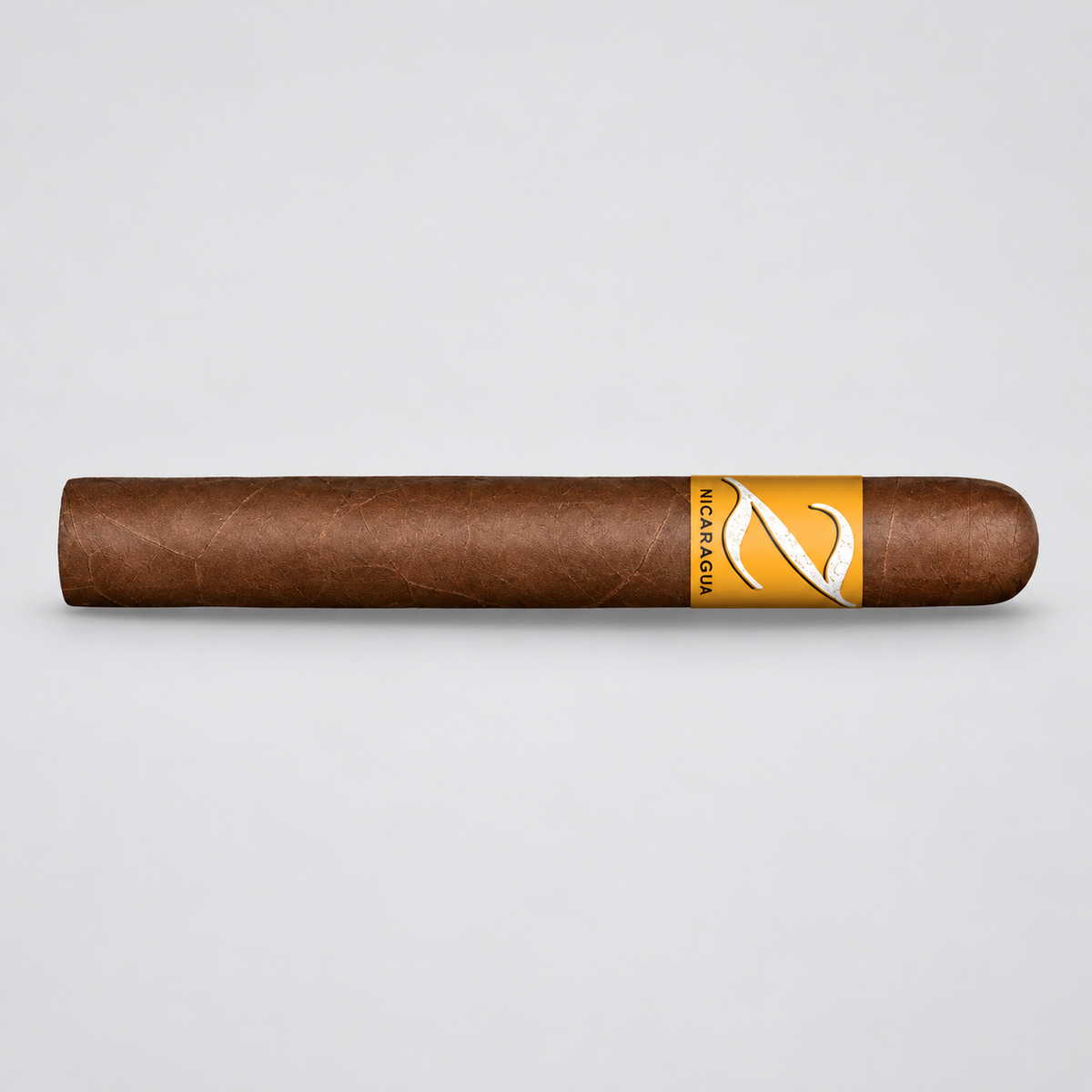 A single brown cigar with a gold and white band labeled 'Kaleidoscope', photographed horizontally against a light gray background.