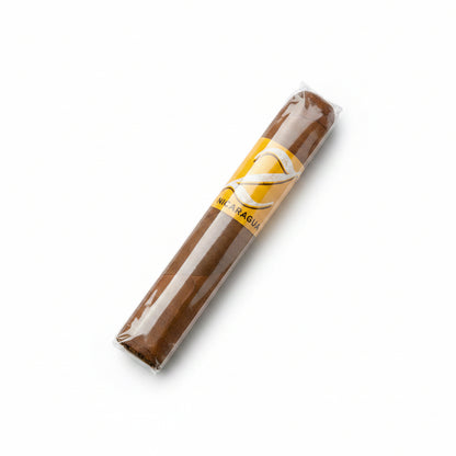 Zino half corona Cigar with a yellow label on a marble surface
