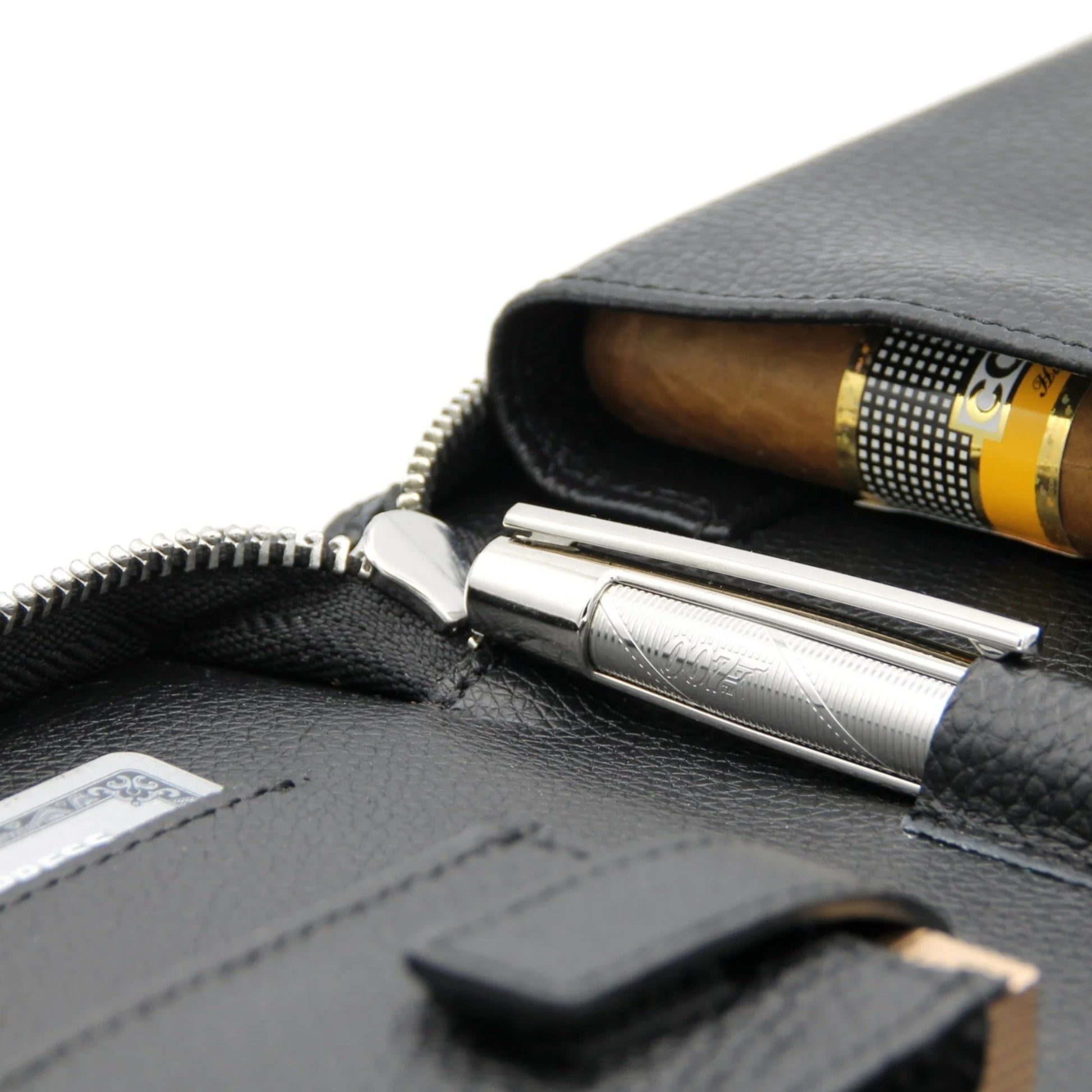 Black leather case with a silver PEN and a cigar inside, on a white background