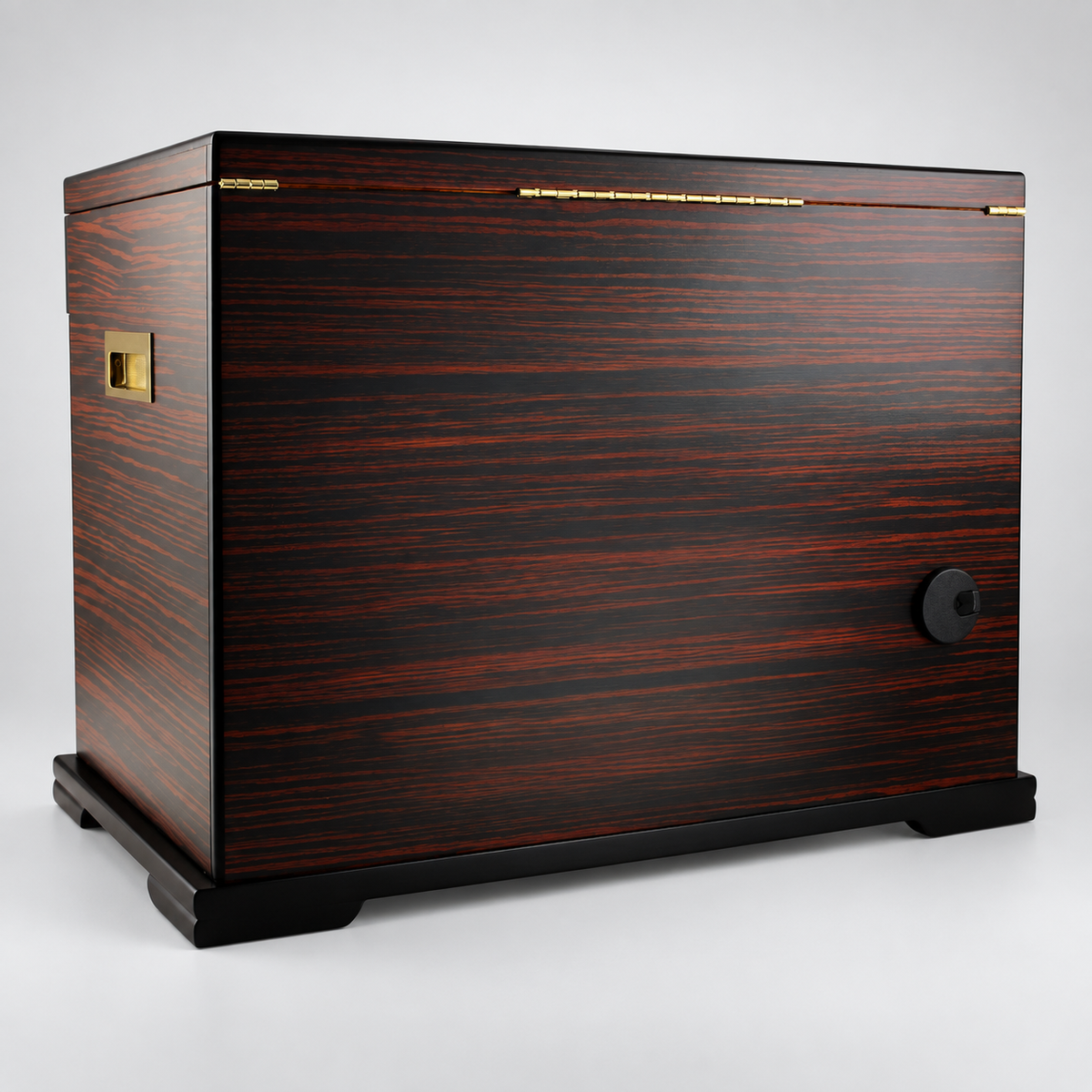 A luxury cigar humidor box with a dark reddish-brown wood grain finish, featuring gold-tone metal accents and a black circular lock on the front, set against a light gray background.