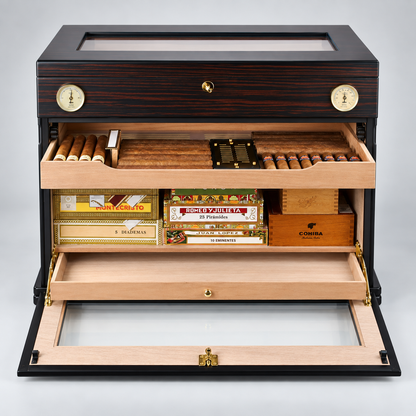 A luxury humidor and cigar storage cabinet with a dark wood grain exterior, brass dials, and open drawers displaying cigars, cigar boxes, and interior compartments. Visible brands include Concha and Colortone on the cigar box inside.