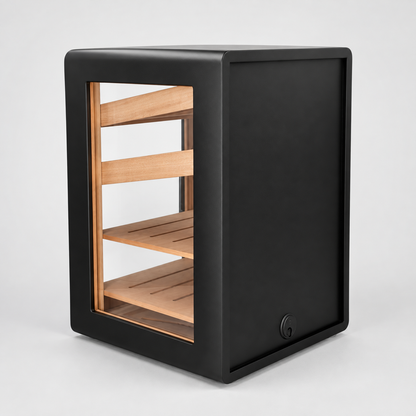 A modern black humidifier or cigar cabinet with a glass front panel showing light wood shelves inside, photographed on a clean light gray studio background.