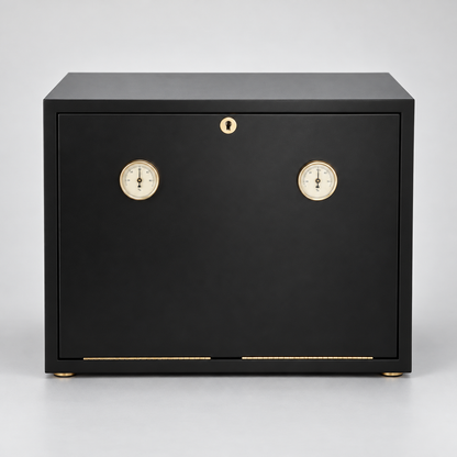 A black wooden humidor safe with two round dials and a small gold lock on the front door, set against a neutral gray background.