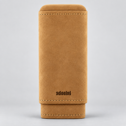 A tan suede or nubuck pouch with a flap closure, featuring contrast stitching and the brand name 'adosini' printed in black near the bottom, set against a neutral gray background.