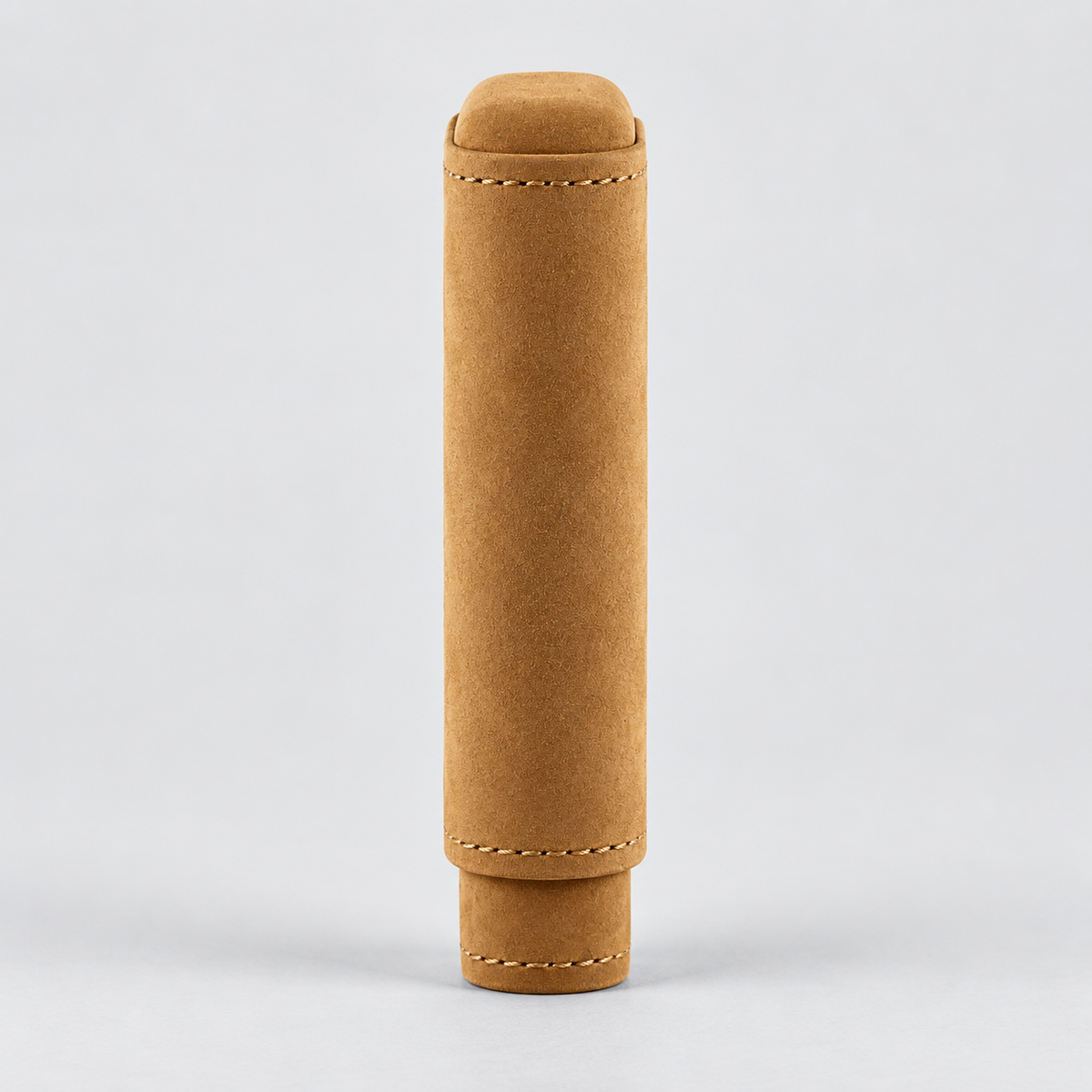 A tan suede or nubuck cylindrical sleeve or cover with stitched details, standing upright on a light gray background.