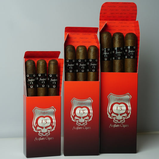 Three open red boxes of Asylum Cigars on a gray background