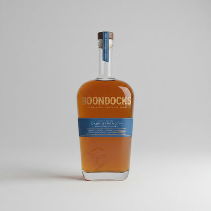 Boondock's whiskey bottle on a wooden surface with a blurred natural background