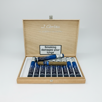 Wooden box of J. Cortes cigars with warning label on a white background