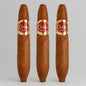 Three brown cigars with red and gold Cuaba Habana cigars bands, arranged vertically against a light gray background.