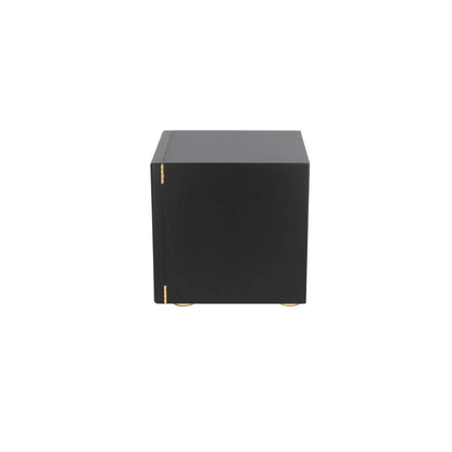 Black cube-shaped object on a white background
