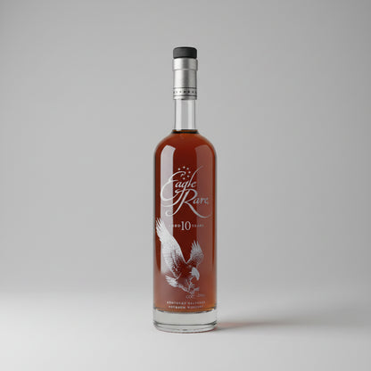 A bottle of Eagle Rare 10 Year Old bourbon whisky stands in a white studio backdrop