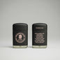 Two black cigar cases with EMS branding on a dark background