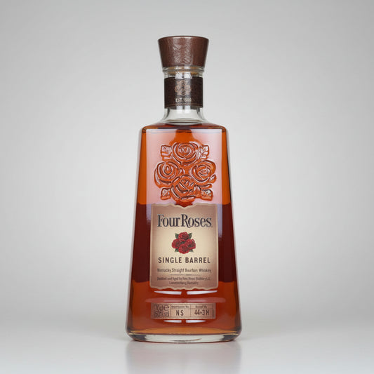 A bottle of Four Roses Single Barrel Whiskey on a white background with a soft reflection. The bottle is made of clear glass showing the amber-brown whiskey inside, with a cream-colored label featuring red rose illustrations and a dark brown cork stopper.