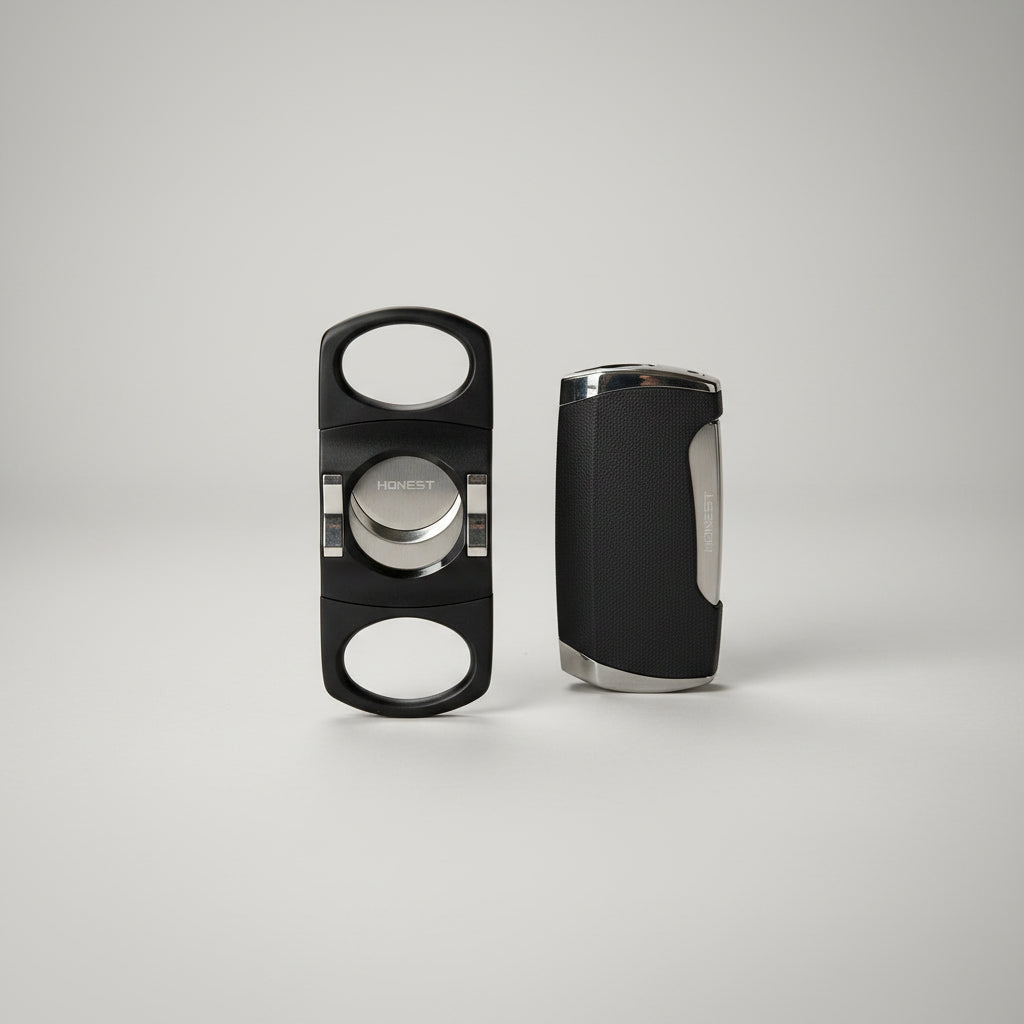 A black cigar cutter and its matching case, both branded HONESTY, displayed on a clean white background.
