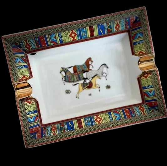 Decorative tray with horse design and colorful geometric border on a brown textured background