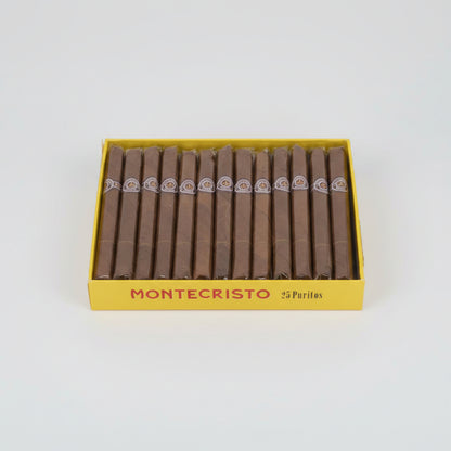 Box of Montecristo cigars with 25 puritos on a yellow background