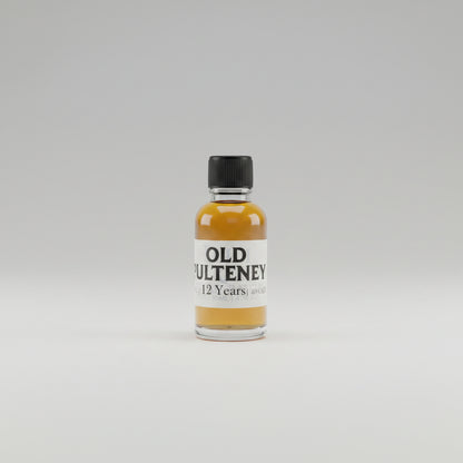Small bottle of old pulteney 12 year old on a bar counter with a blurred whitebackground.