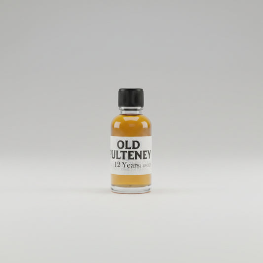 Small bottle of old pulteney 12 year old on a bar counter with a blurred whitebackground.
