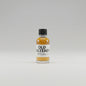 Small bottle of old pulteney 12 year old on a bar counter with a blurred whitebackground.