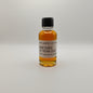 Small bottle of Rhetoric 25 Year Old whiskey sample on a white background