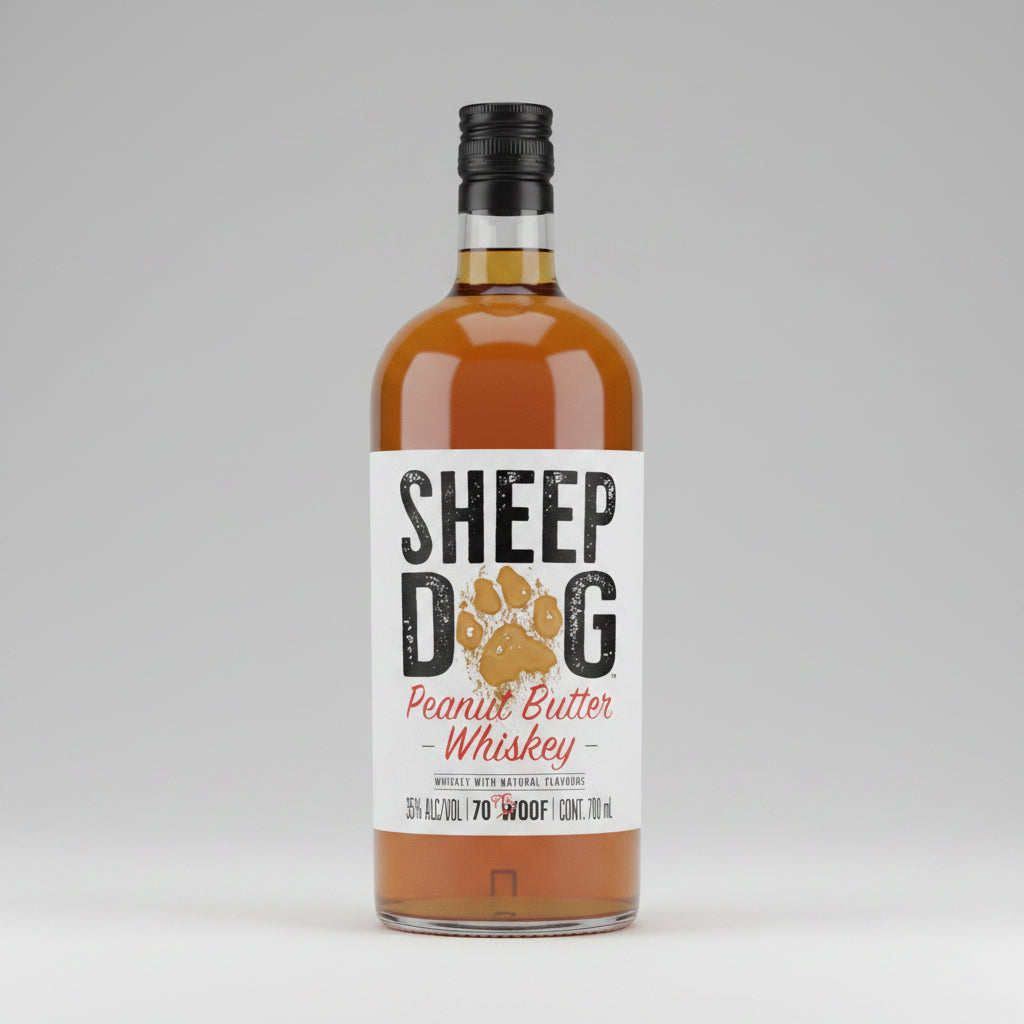 A bottle of Sheep Dog Peanut Butter Whiskey with a white label featuring a dog paw print and bold black and red lettering, filled with amber-colored liquor and topped with a black cap.