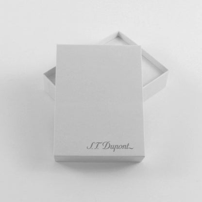 A minimalist white gift box with its lid slightly offset behind, featuring the elegant cursive brand name 'S.T.