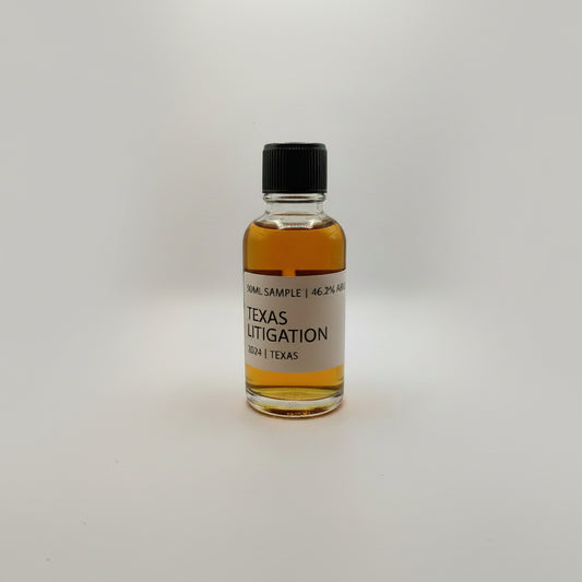Small bottle of Texas Litigation bourbon with a label on a white background