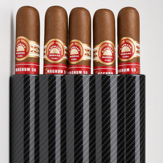 A black carbon-fiber-pattern cigar humidor holding five cigars with red and gold bands, photographed on a light gray studio background.