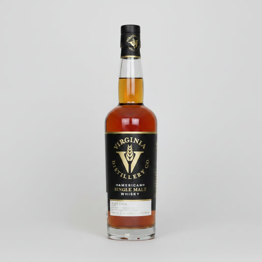 A bottle of Virginia Distillery Co. American Single Malt Whisky, featuring amber-colored liquid in a clear glass bottle with a black label and gold lettering, set against a plain white background.