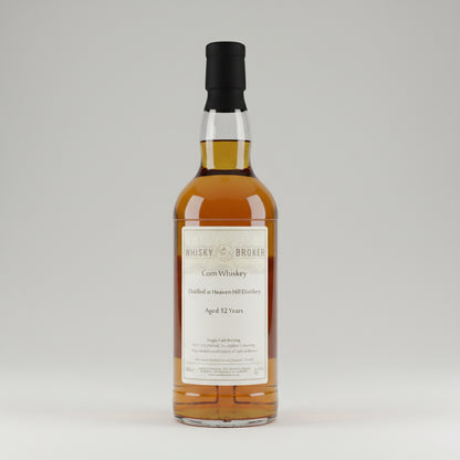 A bottle of whisky Broker with amber liquid, a cream label reading 'Whisky Broker Corn Whiskey' and 'Aged 12 Years', and a black cap, shown against a plain light background.