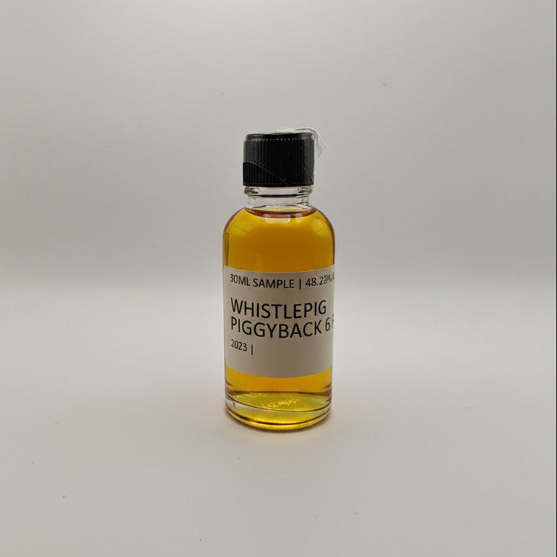 Small bottle of Whistlepig Piggyback Rye on a white background