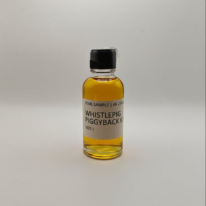 Small bottle of Whistlepig Piggyback Rye on a white background