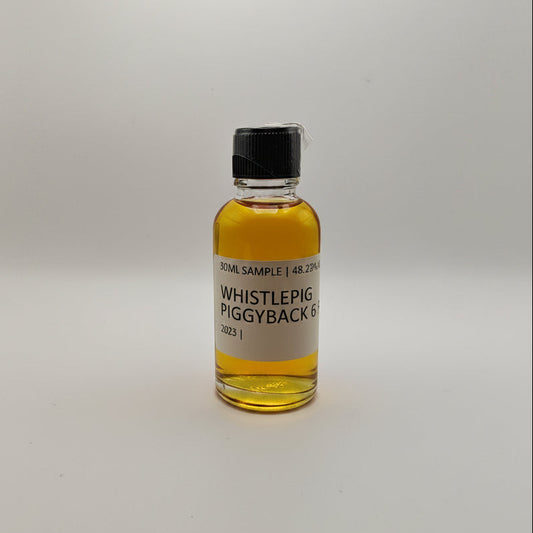 Small bottle of Whistlepig Piggyback Rye on a white background